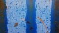 Blue painted rusty metal wall background with copy space