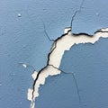 Blue painted wall exhibiting significant cracking and peeling Royalty Free Stock Photo