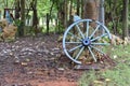 Blue painted wheel near the entrance of a Cuban public park