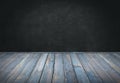 Blue painted wood table with dark wall background