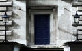 Blue wooden Door with symmetrical lighters on sides