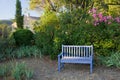 Blue painted wooden garden bench, Provence, France. Royalty Free Stock Photo