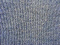 Blue pale woolen knitted fabric texture Royalty Free Stock Photo