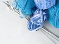 Blue palette woolen yarn with knitting needles