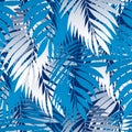 Blue palm leaves in a seamless pattern