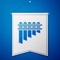 Blue Pan flute icon isolated on blue background. Traditional peruvian musical instrument. Zampona. Folk instrument from Royalty Free Stock Photo