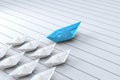 Blue paper boat as leader leads the young followers across white plank floor surface - leadership in team crowd metaphor