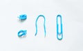 Blue paper clip on white background. stationery office. Royalty Free Stock Photo