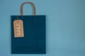 Blue paper craft bag with sale tag Royalty Free Stock Photo