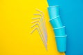 Blue Paper Cups With Drinking Colored Plastic Straws Yellow And Blue Background. Set For Party. Top View. Minimalist Style. Copy,