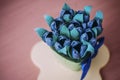 Blue paper flowers on the pink table Royalty Free Stock Photo