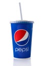 Blue paper glass with Pepsi Cola isolated on white background. Takeaway carbonated drink in a cap and straw. Brand logo.