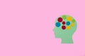 blue paper head with colorful dots instead of brain isolated on pink background, next to head copy space Royalty Free Stock Photo