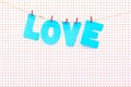 Love sign made out of blue paper letters