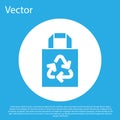 Blue Paper shopping bag with recycle icon isolated on blue background. Bag with recycling symbol. White circle button Royalty Free Stock Photo