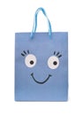 Blue paper shopping bag with smiling funny face Royalty Free Stock Photo