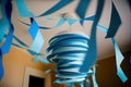 blue paper streamer hanging from ceiling at birthday party Royalty Free Stock Photo