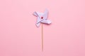 Blue paper windmill pinwheel isolated on pink background, Circus, Childhood, Festival, Party, Fun, joy, Happines