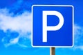 Blue parking sign against blue cloudy sky background Royalty Free Stock Photo