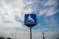 Blue parking sign for disabled persons on local mall parking lot Royalty Free Stock Photo