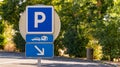 Blue parking sign in French autoroute roadside stop Royalty Free Stock Photo