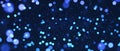 Blue particles shining dust bokeh glitter abstract background. Royalty Free Stock Photo