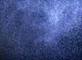 BLUE PARTICLES SWIRLING IN TURBULENT AIR