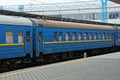 Blue passenger car stands at the railway station Royalty Free Stock Photo