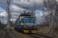 Blue passenger Czech old train in Velesin station in winter day