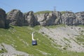 Blue passenger ropeway cabin running to the peak of mountain in Melchsee-Frutt region. Royalty Free Stock Photo