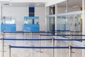 Blue passport control cabines at the empty airport terminal