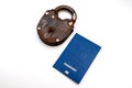 Blue passport with an old golden lock on a white background. Coronavirus and travel concept Royalty Free Stock Photo