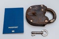 Blue passport with old lock and key on a white background. Coronavirus and travel concept Royalty Free Stock Photo