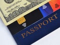 Blue passport, one hundred dollars bill and three different credit cards Royalty Free Stock Photo