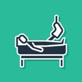 Blue Patient with broken leg is in the hospital icon isolated on green background. Hospitalization of the patient. Sick Royalty Free Stock Photo