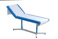 BLue patient Examination Table. doctor`s office on white Royalty Free Stock Photo