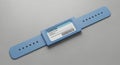 Blue Patient ID Wristband with Barcode on Gray Background Royalty Free Stock Photo
