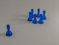 The blue pawn is ostracized from the other pawn collection, 3d illustration Royalty Free Stock Photo