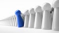Blue pawn in a row of white figures Royalty Free Stock Photo