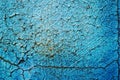 Blue peeling paint and scratches on wall of a house, close up Royalty Free Stock Photo