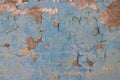 Blue peeling paint on the wall. Old concrete wall with cracked flaking paint. Royalty Free Stock Photo