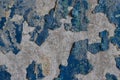 Blue peeling paint on the wall. Old concrete wall with cracked flaking paint. Royalty Free Stock Photo
