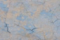 Blue peeling paint on the wall. Old concrete wall with cracked flaking paint. Royalty Free Stock Photo
