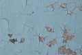 Blue peeling paint on the wall. Old concrete wall with cracked flaking paint. Royalty Free Stock Photo