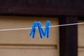 Blue pegs on a washing line Royalty Free Stock Photo