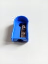 Blue pencil sharpener with rusty blade Royalty Free Stock Photo