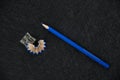 Blue pencil sharpener and sharpened rubbish Royalty Free Stock Photo