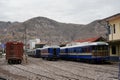 Blue Perurail Train carriages standing in Cusco Station with \
