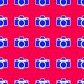 Blue Photo camera icon isolated seamless pattern on red background. Foto camera icon. Vector Royalty Free Stock Photo