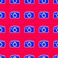 Blue Photo camera icon isolated seamless pattern on red background. Foto camera icon. Vector Royalty Free Stock Photo